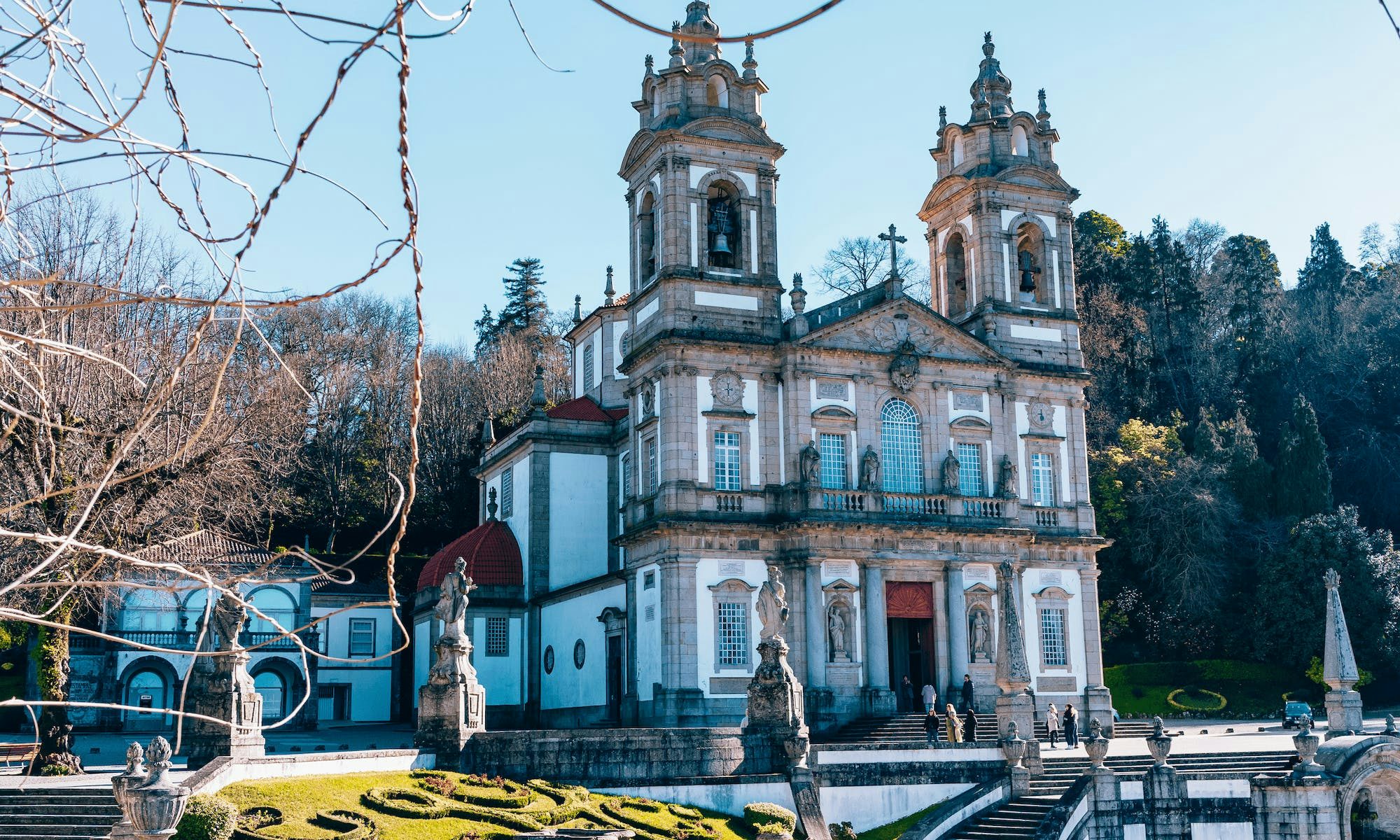 Historic Bom Jesus de Braga church, with its intricate architecture and grandeur, set against a clear sky in Braga, Portugal.